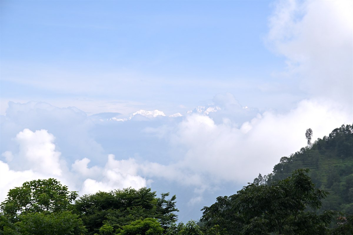 Mount Kanchenjunga Snow-Capped Himalayan Peaks Above Clouds